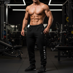 Muscular person wearing black gym wear Crest Jogger in a gym setting